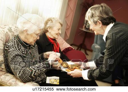 Elderly women having cookies View Large Photo Image Stock Photography - Elderly women having cookies. Fotosearch