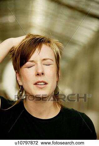 Stock Image - Expression of pain. Fotosearch