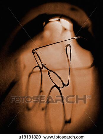 Eye glasses on bare back View Large Photo Image Stock Image - Eye glasses on bare back. Fotosearch