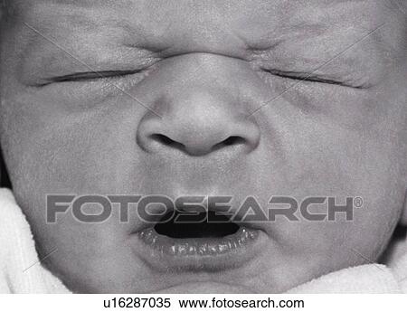 Stock Photography - Face of newborn baby. Fotosearch