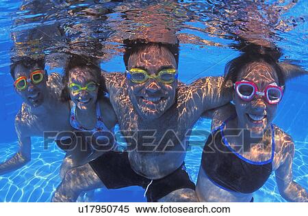 Family group in swimming pool View Large Photo Image Stock Photography - Family group in swimming pool. Fotosearch