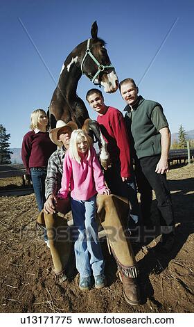 Family poses with a horse View Large Photo Image Stock Photography - Family poses with a horse. Fotosearch