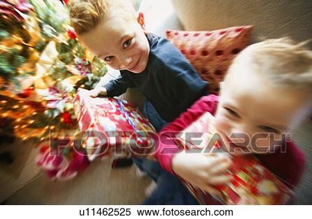 Family with presents View Large Photo Image Stock Photography - Family with presents. Fotosearch