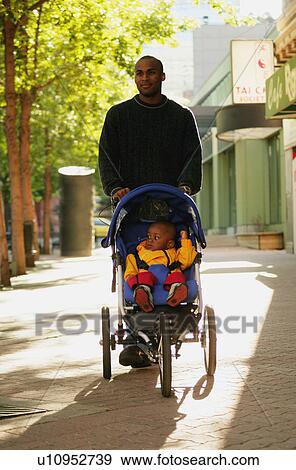 Stock Photo - Father and child on a walk. Fotosearch