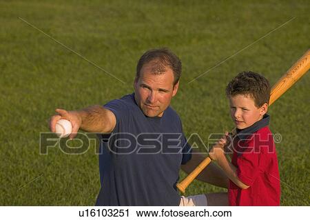 Father and son play baseball View Large Photo Image Stock Image - Father and son play baseball. Fotosearch