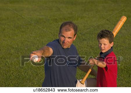 Stock Image - Father and son play baseball. Fotosearch