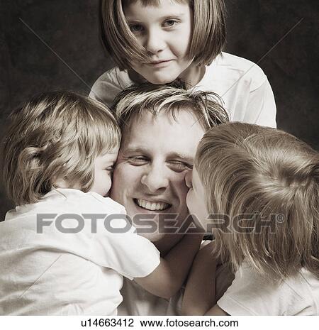 Stock Image - Father with daughters. Fotosearch