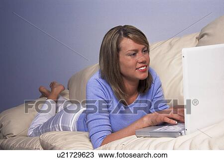 Feet up laptop View Large Photo Image Stock Image - Feet up laptop. Fotosearch