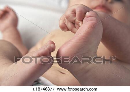 Stock Photo - Finding feet. Fotosearch