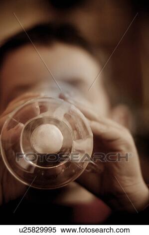 Stock Photography - Finishing a warm drink. Fotosearch