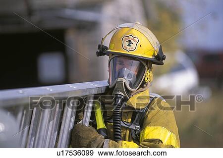 Fireman carrying ladder View Large Photo Image Stock Photo - Fireman carrying ladder. Fotosearch