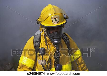 Picture - Fireman in front of smoke. Fotosearch