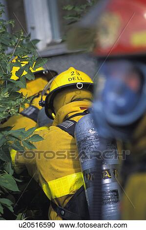 Firemen walking to building View Large Photo Image Stock Image - Firemen walking to building. Fotosearch