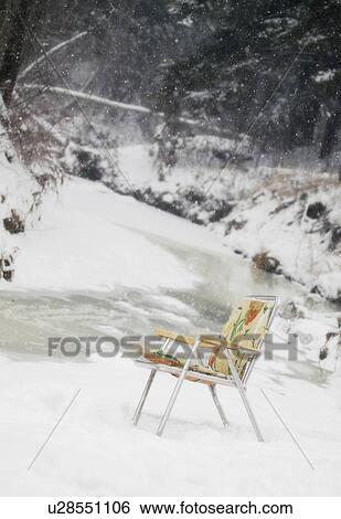 Folding chair in the snow View Large Photo Image Stock Photograph - Folding chair in the snow. Fotosearch