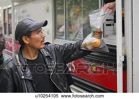 Food being given to a man View Large Photo Image Stock Photography - Food being given to a man. Fotosearch