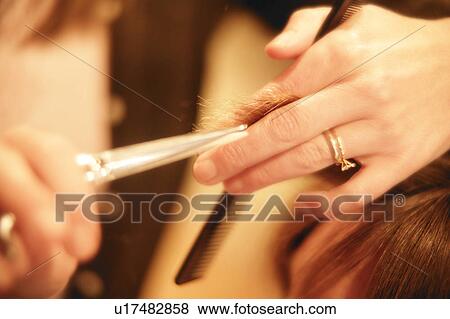 Stock Photo - Getting a haircut. Fotosearch