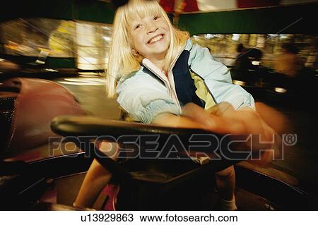 Girl at amusement park View Large Photo Image Stock Image - Girl at amusement park. Fotosearch