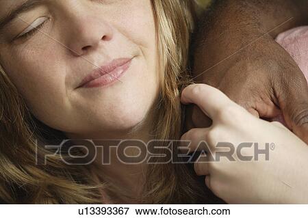 Girl holding comforting hand of someone View Large Photo Image Stock Photo - Girl holding comforting hand of someone. Fotosearch