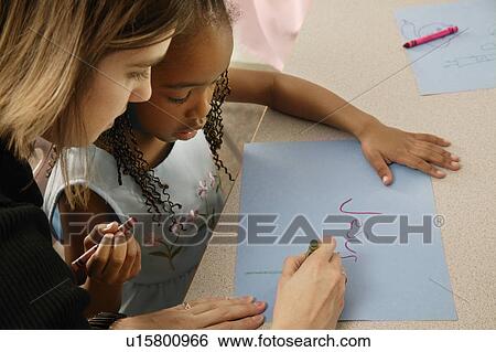 Girl learns how to print View Large Photo Image Stock Photograph - Girl learns how to print. Fotosearch