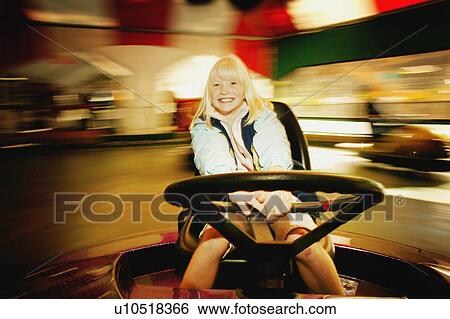 Girl on a ride View Large Photo Image Stock Photograph - Girl on a ride. Fotosearch