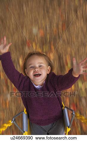 Stock Image - Girl on swing. Fotosearch