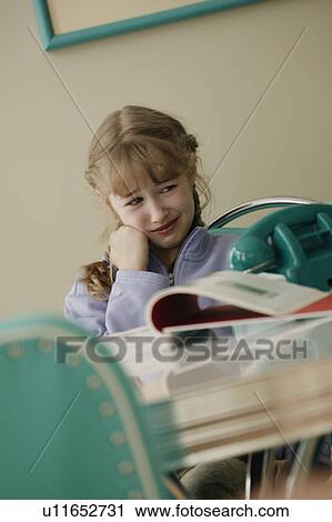 Girl thinking about doing homework View Large Photo Image Stock Image - Girl thinking about doing homework. Fotosearch