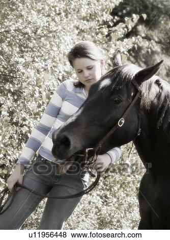 Stock Photo - Girl with horse. Fotosearch