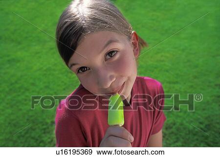 Stock Photo - Girl with popsicle. Fotosearch