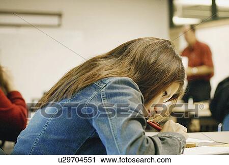 Girl works on homework View Large Photo Image Stock Image - Girl works on homework. Fotosearch