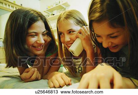 Stock Image - Girls on the telephone. Fotosearch
