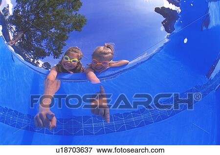 Stock Photo - Girls pointing into pool. Fotosearch