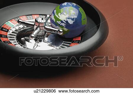 Globe in a roulette wheel View Large Photo Image Stock Photograph - Globe in a roulette wheel. Fotosearch