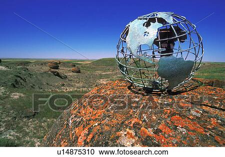 Stock Image - Globe overlooking valley. Fotosearch