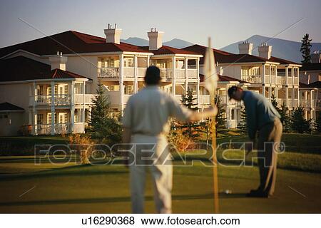 Golfing at a resort View Large Photo Image Stock Photo - Golfing at a resort. Fotosearch