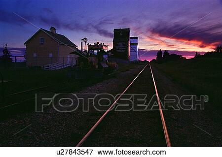 Grain elevators at sunset View Large Photo Image Stock Photo - Grain elevators at sunset. Fotosearch