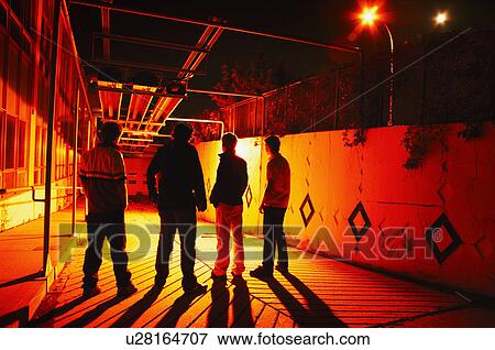 Group hanging out at night View Large Photo Image Stock Photo - Group hanging out at night. Fotosearch