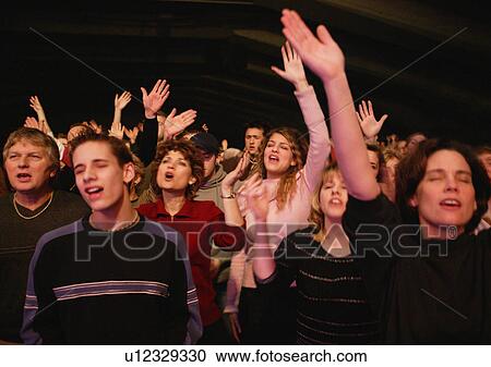 Stock Image - Group worshipping. Fotosearch
