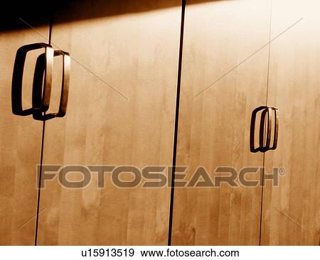Stock Photo - Handles on storage cabinets. Fotosearch