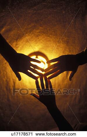 Hands over light View Large Photo Image Stock Image - Hands over light. Fotosearch