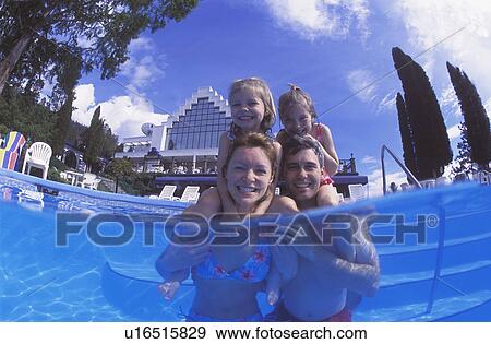Happy family time in swimming pool View Large Photo Image Stock Photo - Happy family time in swimming pool. Fotosearch