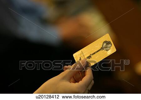 Stock Image - Holding a card key. Fotosearch