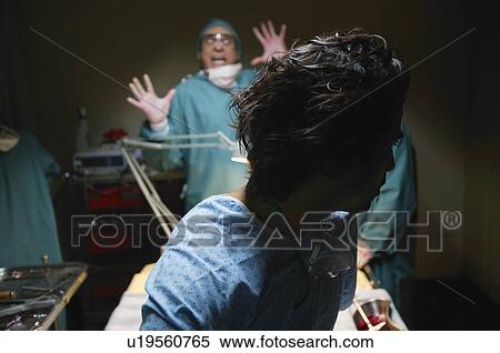 Stock Photography - Horrified doctor. Fotosearch