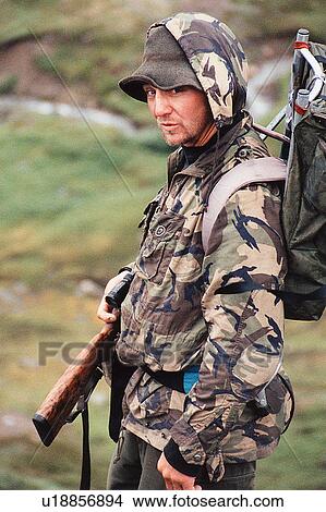 Picture - Hunter wearing camouflage. Fotosearch