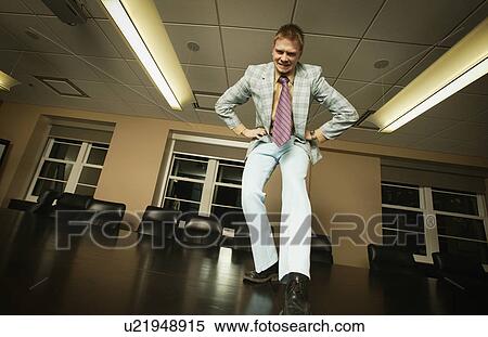 Stock Photography - I got style - dancing on boardroom table. Fotosearch