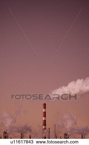 Stock Image - Industrial chimneys and fumes. Fotosearch