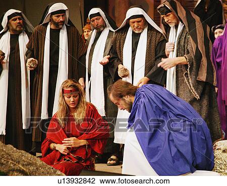 Stock Image - Jesus draws in the sand. Fotosearch