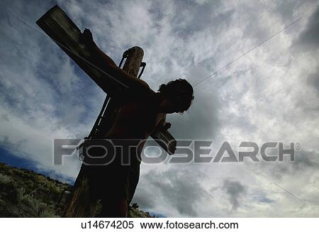 Jesus hangs on the cross View Large Photo Image Stock Photography - Jesus hangs on the cross. Fotosearch
