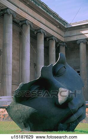 Large sculpture of face in colonnaded courtyard View Large Photo Image Stock Photo - Large sculpture of face in colonnaded courtyard. Fotosearch