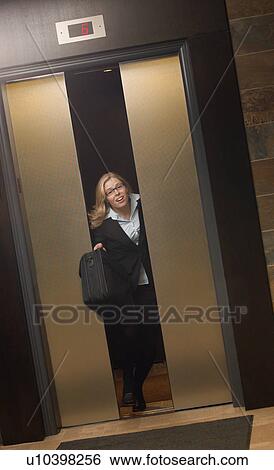 Late for work-getting off elevator View Large Photo Image Stock Photograph - Late for work-getting off elevator. Fotosearch