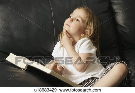 Stock Photo - Little girl reading. Fotosearch